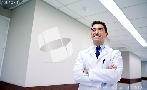 Image of smiling doctor at hospital corridor