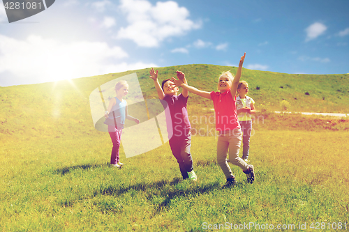 Image of group of happy kids running outdoors