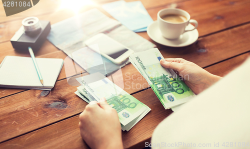 Image of close up of traveler hands counting euro money