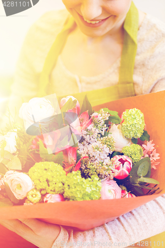 Image of close up of woman with bunch at flower shop