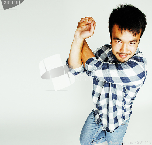 Image of young cute asian man on white background gesturing emotional, po