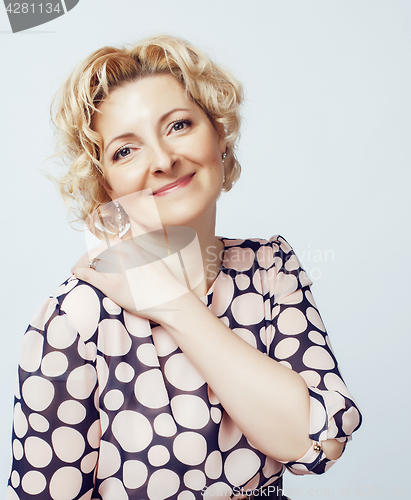 Image of mature blond curly woman cheerful posing on white background isolated, lifestyle people concept