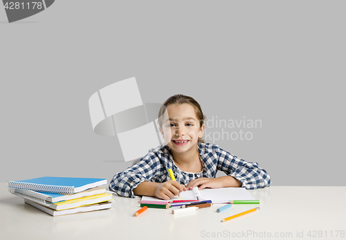 Image of Little girl making drawings