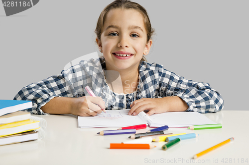 Image of Little girl making drawings