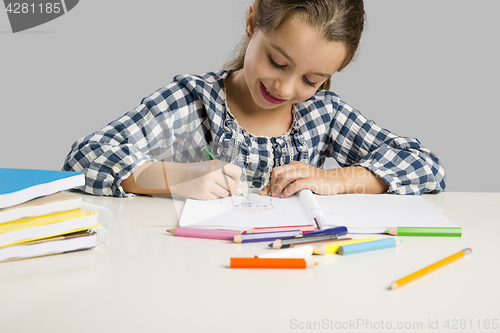 Image of Little girl making drawings