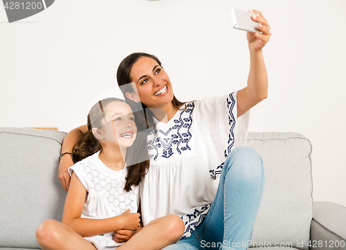 Image of Mom and Daughter making a selfie