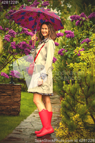 Image of Beautiful woman with an umbrella