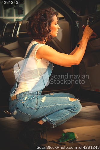 Image of Beautiful woman car mechanic