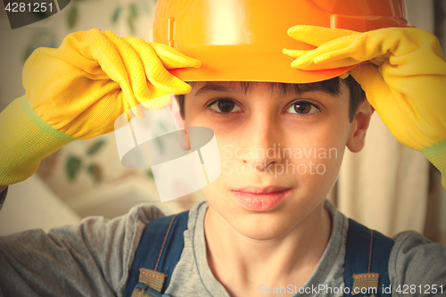 Image of boy in a construction helmet