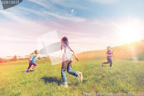 Image of group of happy kids running outdoors