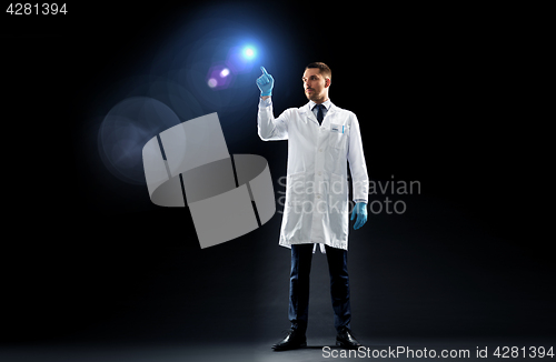 Image of doctor or scientist in lab coat with light