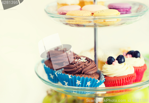 Image of close up of cake stand with cupcakes and cookies