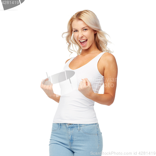 Image of happy young woman doing fist pump gesture