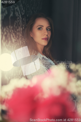 Image of Woman portrait in the dark room