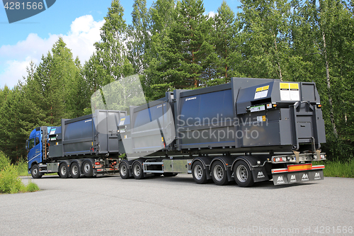Image of Truck Transports Waste Compactors