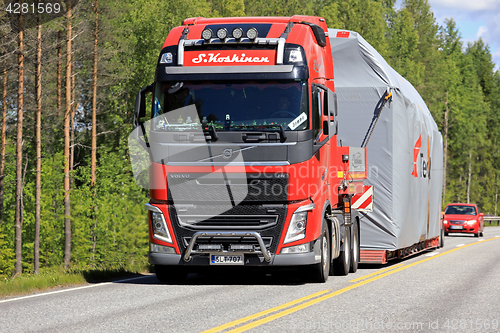 Image of Red Volvo FH Wide Load Transport