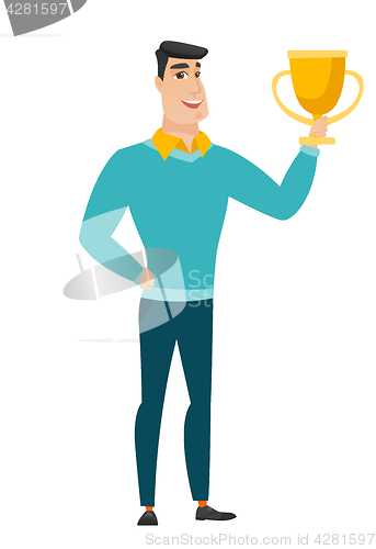 Image of Caucasian business man holding a trophy.