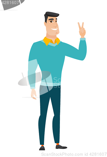 Image of Caucasian businessman showing the victory gesture.