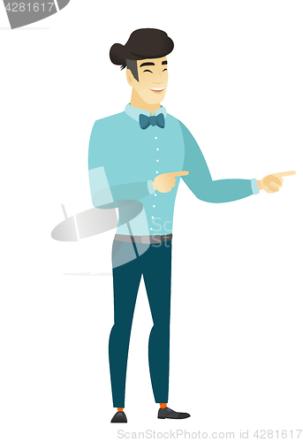 Image of Young asian businessman pointing to the side.