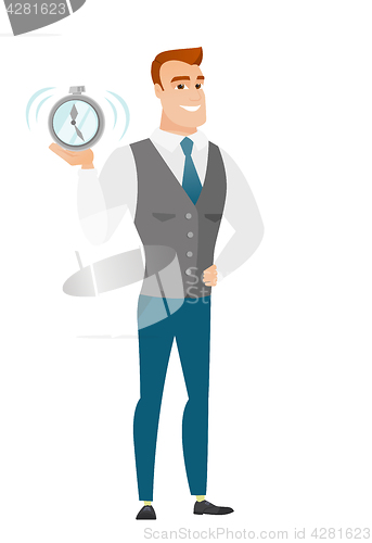 Image of Caucasian business man holding alarm clock.