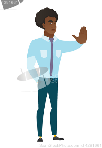 Image of Caucasian businessman showing stop hand gesture.