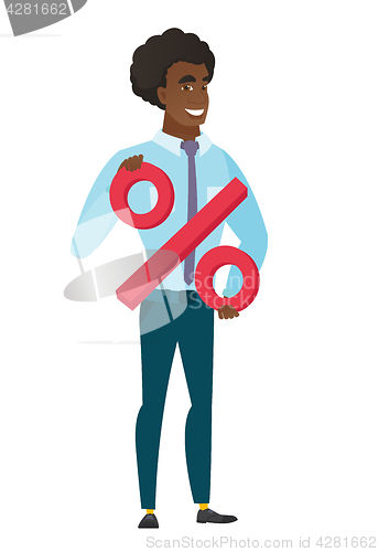 Image of Smiling businessman holding percent sign.