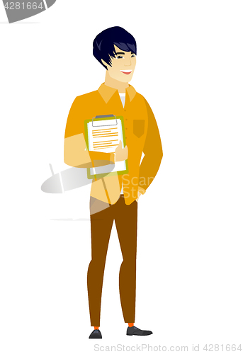 Image of Businessman holding clipboard with papers.