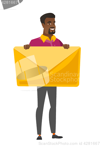 Image of Smiling businessman holding a big envelope.