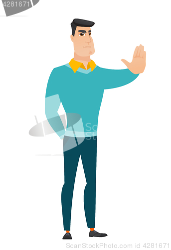 Image of Caucasian businessman showing stop hand gesture.