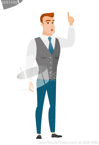 Image of Businessman with open mouth pointing finger up.