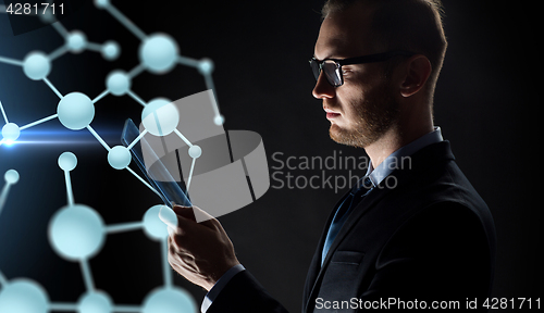 Image of close up of businessman with transparent tablet pc