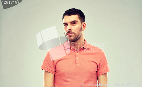 Image of man thinking over gray background