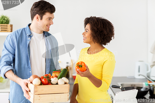 Image of happy couple with healthy food at home kitchen