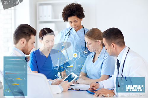 Image of group of doctors with tablet pc at hospital