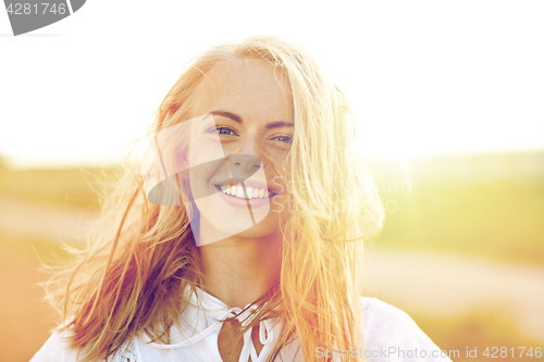 Image of close up of happy young woman in white outdoors