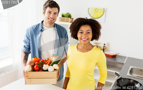 Image of happy couple with healthy food at home kitchen