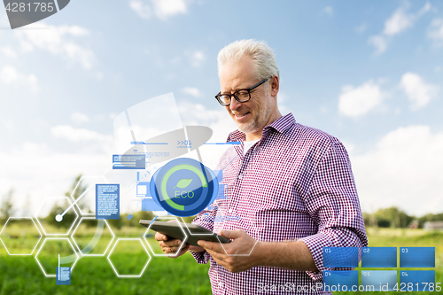 Image of senior man with tablet pc computer at county