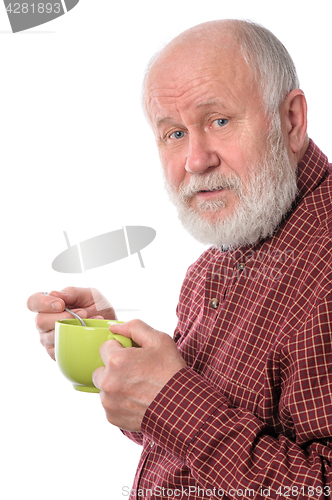 Image of Cheerfull senior man with green cup, isolated on white