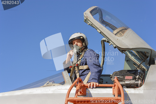 Image of Military pilot in the cockpit of a jet aircraft