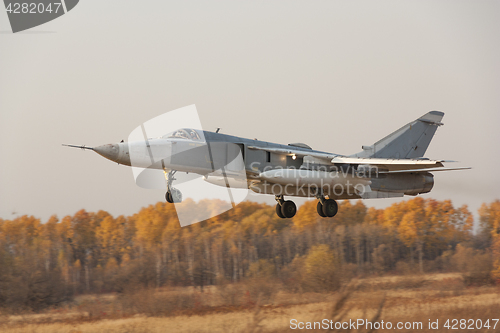 Image of Military jet bomber Su-24 Fencer flying