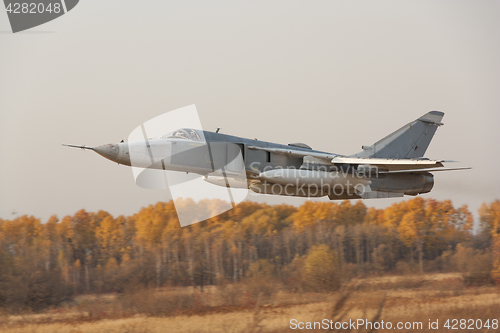 Image of Military jet bomber Su-24 Fencer flying