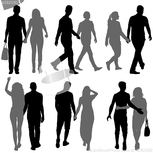 Image of Set Silhouette man and woman walking hand in hand