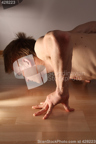 Image of Man doing pushups