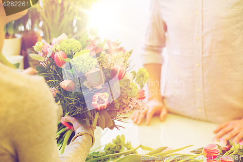 Image of close up of florist woman and man at flower shop