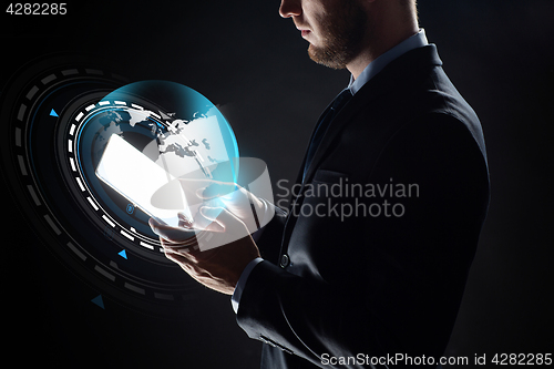 Image of close up of businessman with transparent tablet pc