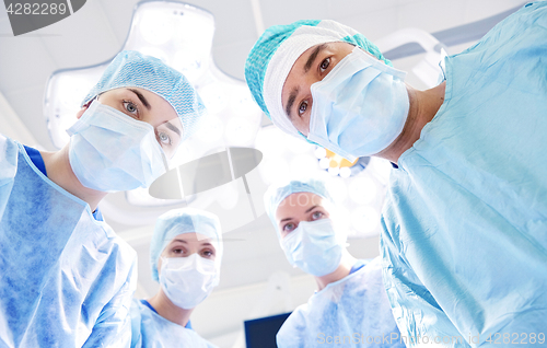 Image of group of surgeons in operating room at hospital