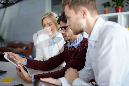 Image of business team with tablet pc at office