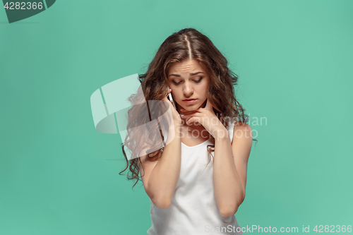 Image of The portrait of disgusted woman with mobile phone