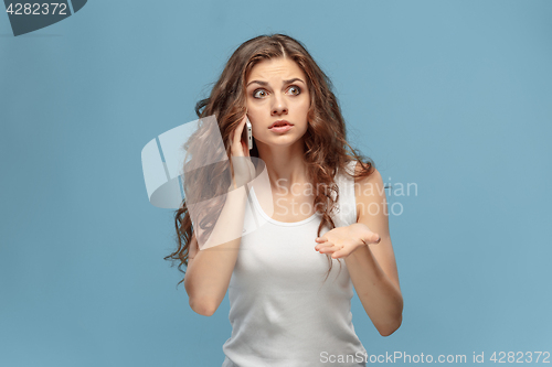 Image of The portrait of disgusted woman with mobile phone