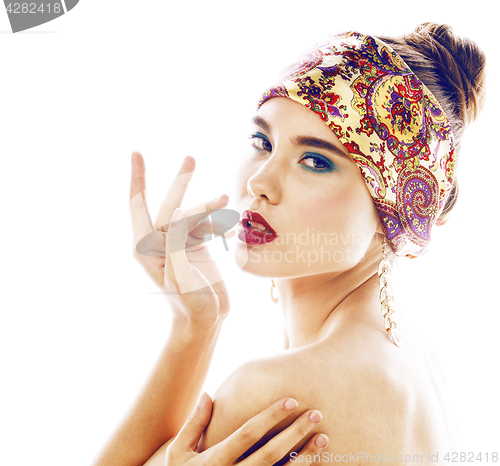 Image of young pretty modern girl with bright shawl on head emotional posing isolated on white background, asian people ethnicity